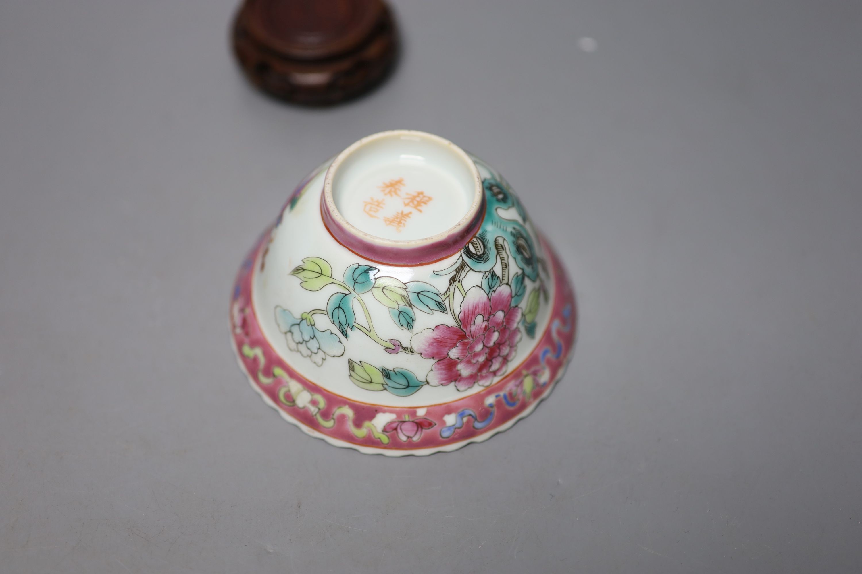 A Chinese Straits famille rose ‘dragon’ bowl, 11cm, and a carved wood figure of a Budai, 28cm